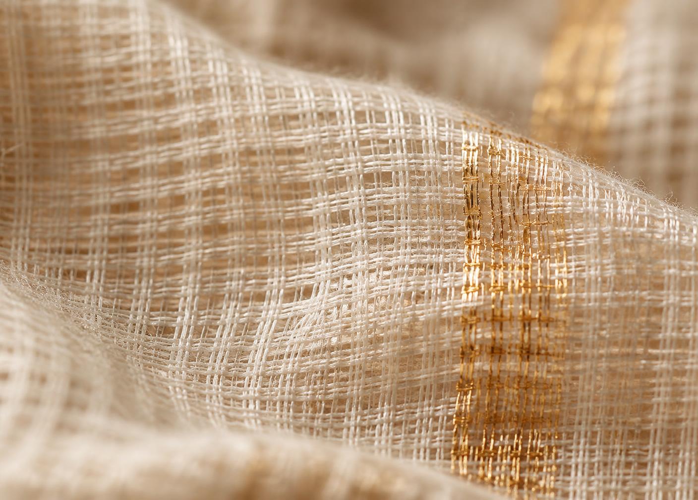 Macro detail of the square khat weave with gold zari thread